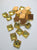 Square gold foiled two hole crystal Austrian flatbacks. Measuring 1cm. Sold by the dozen. $3.00 per dozen. - Accessories Of Old