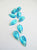 Vintage turquise colored flatbacks. Two hole. Gold foiled backing. 11mm. ( sold in lot of 980 beads at $98.00) - Accessories Of Old